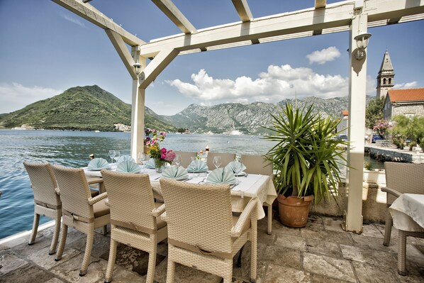 Breakfast, lunch, dinner served; Mediterranean cuisine, beach views