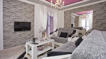 Comfort Apartment, Partial Sea View | Living area | LCD TV