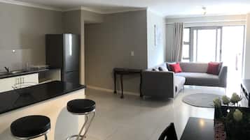 Executive Apartment | Living area | Flat-screen TV