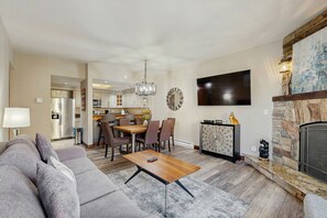 TV, fireplace, books - Updated Breck Condo w/ Fireplace, Balcony Views & Walkable Location (Breckenridge)