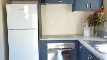 Family 2 Bedroom Beach House | Private kitchen | Full-sized fridge, microwave, oven, stovetop