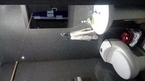 A bathroom with a white sink, a mirror, and a toilet. - THE HOUSE OF JOSE Second Floor  (Cuzco)
