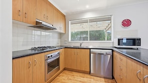 Coffee/tea maker, fridge, microwave, oven