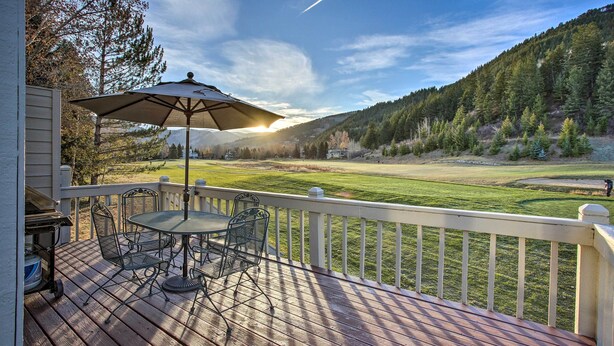 A deck with outdoor furniture and a view of a golf course. - Colorado Home On Golf Course, Near Vail Ski Resort (Avon)