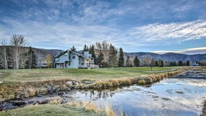 A large house with a spacious lawn and a small stream. - Colorado Home On Golf Course, Near Vail Ski Resort (Avon)