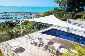 A rooftop pool with a view of a marina and the sea. - A Point of View - Airlie Beach (Airlie Beach)