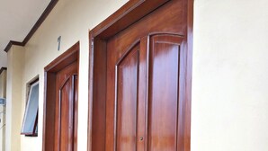 Two wooden doors with a number '7' above them, indicating room numbers.