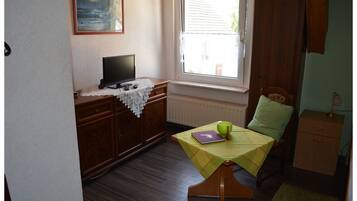 Twin Room | Living area | Flat-screen TV