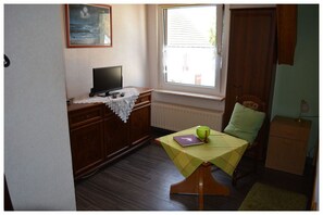 Twin Room | Living area | Flat-screen TV