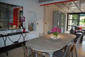Enjoy meals in this stylish dining area with a large round table and comfortable seating for six.