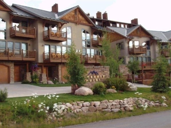 Experience the charm of Luxury Point, where rustic architecture meets serene gardens and inviting balconies.