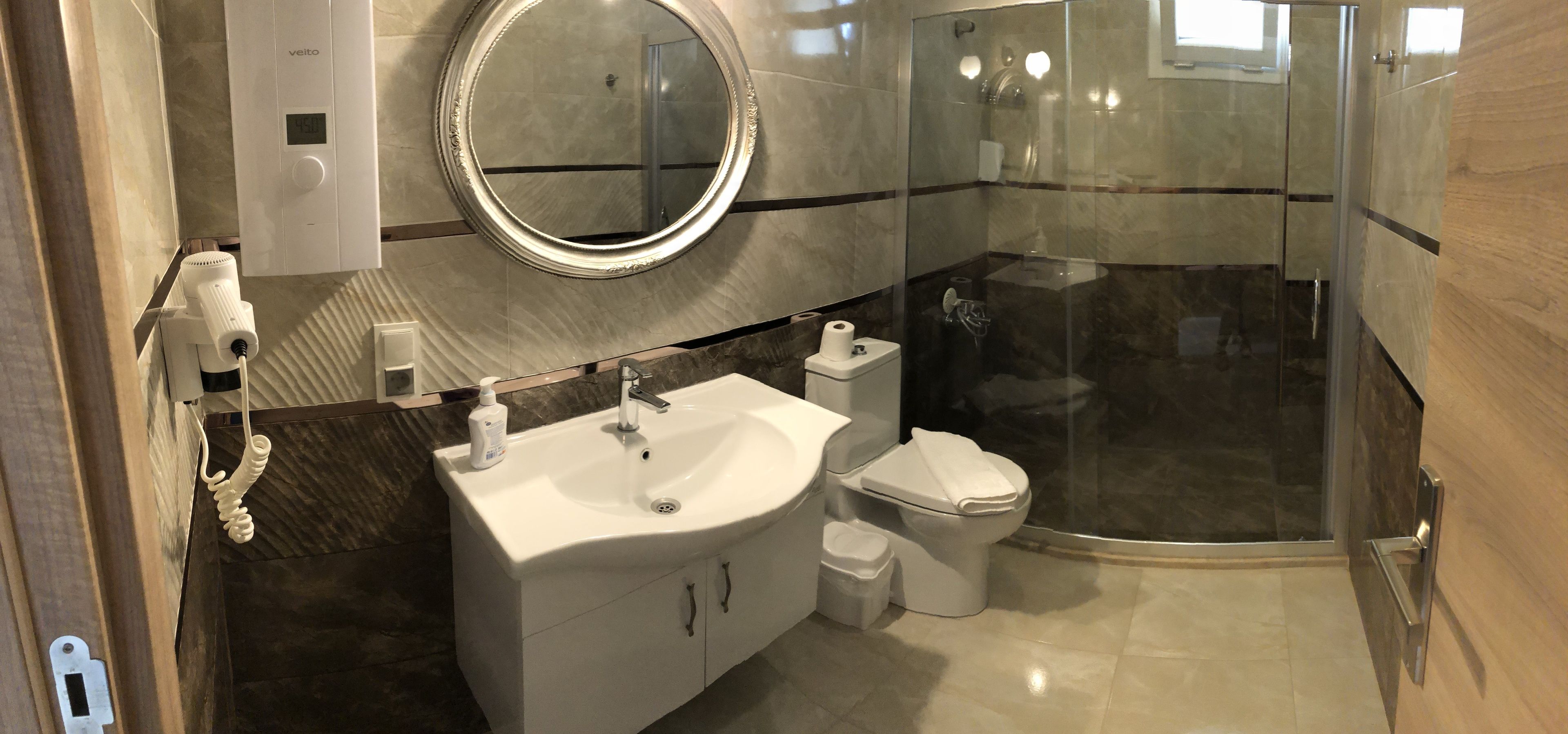 deluxe room, sea view | bathroom | shower, rainfall showerhead, hair dryer, slippers