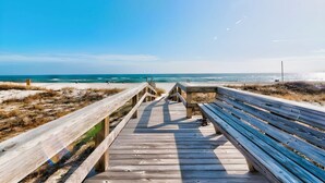 A wooden boardwalk leading to a beach with a clear view of the ocean. - Unbelievable Views!! Newly remodeled condo, Beachfront in fantastic location! (Orange Beach)
