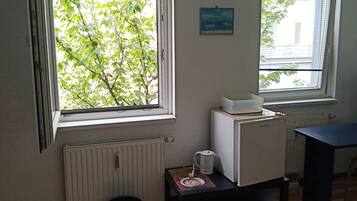 1 bedroom, desk, iron/ironing board, travel crib
