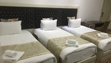 Basic Triple Room | Minibar, in-room safe, desk, soundproofing