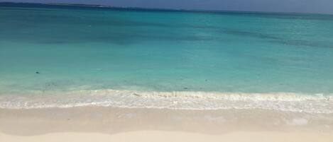 On the beach, sun-loungers, beach towels