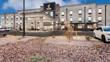 Situated on a well-maintained area, this hotel offers a modern architectural design with a flat roof and covered entrance.
