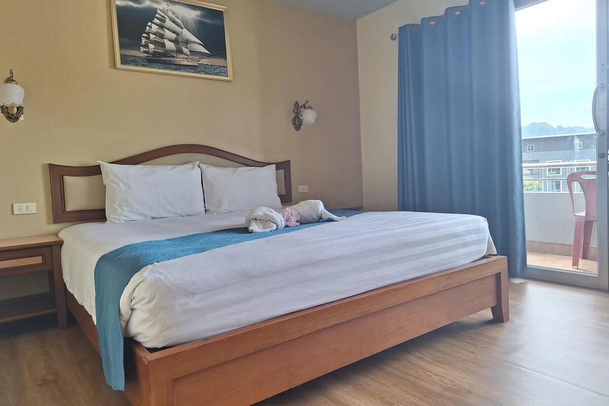Double Room, Partial Sea View | In-room safe, desk, laptop workspace, blackout drapes