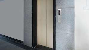 An elevator with a digital display showing floor numbers. - OYO 14184 Hotel Green Stone (Hyderabad)