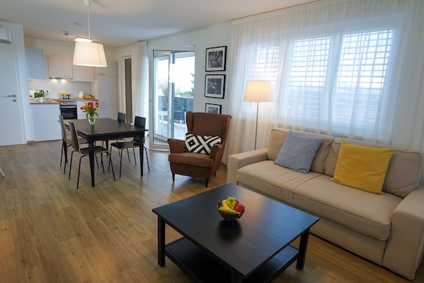 Suite, 1 Bedroom, Balcony | Living area | 105-cm Smart TV with satellite channels, TV, heated floors