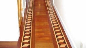 A hallway with wooden flooring and a geometric pattern on the floor. - Comfortable Vacation Home Near ~SFO~ Airport (San Bruno)