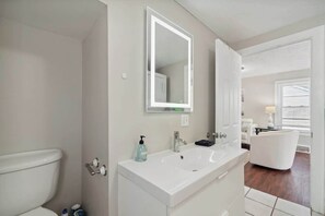 Combined shower/tub, hair dryer, towels, soap