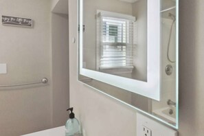 Combined shower/tub, hair dryer, towels, soap
