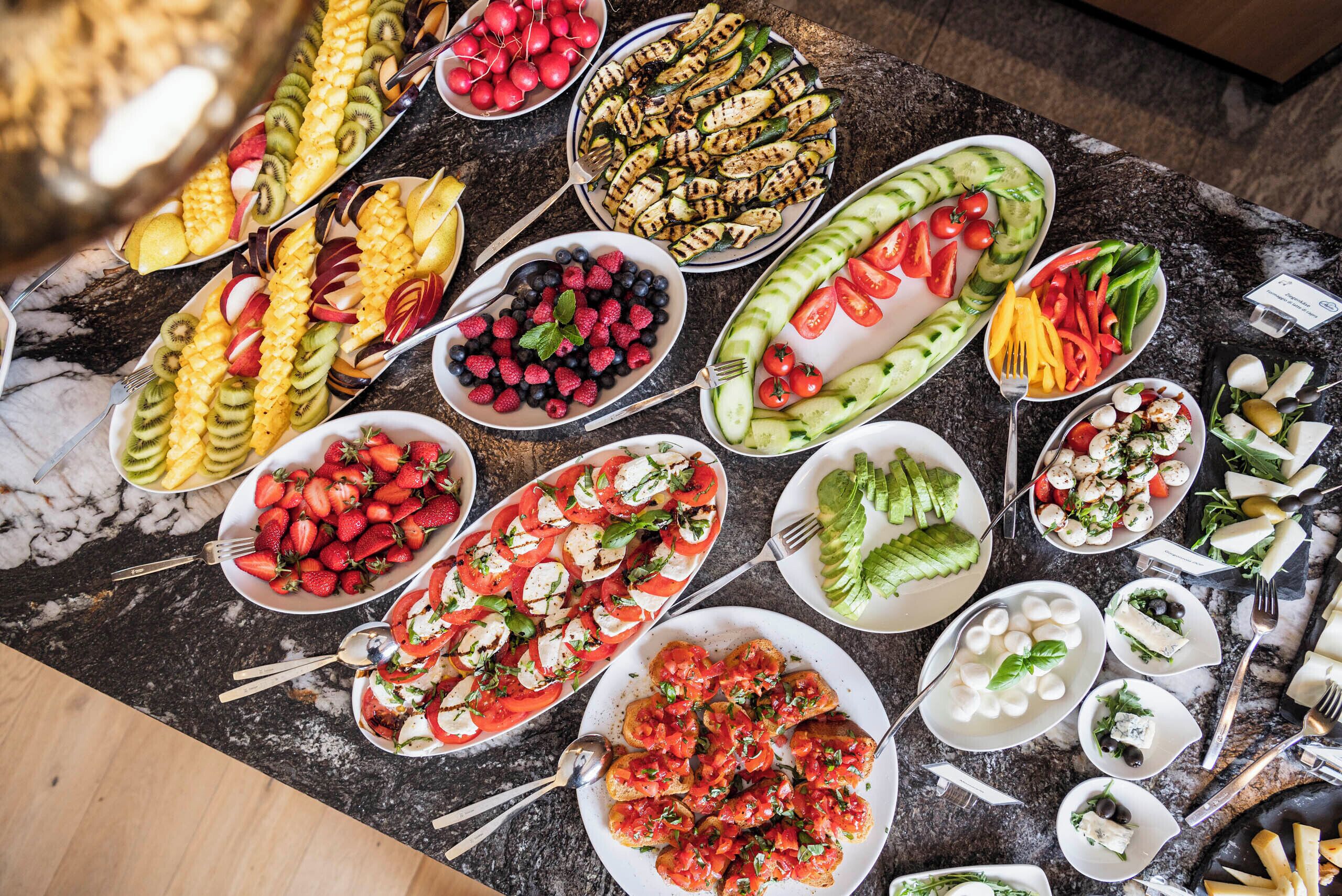 A variety of food items arranged on a marble table.