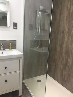 Shower, free toiletries, slippers, towels
