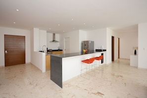 Apartment | Private kitchen | Fridge, microwave, oven, stovetop - Stylish 2BR a few steps to the beach with pools by Happy Address (Playa del Carmen)