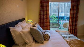 Chambre Deluxe | Coffres-forts dans les chambres, fer et planche Ă repasser