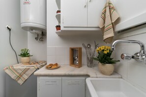 Fridge, coffee/tea maker, toaster, cookware/dishes/utensils