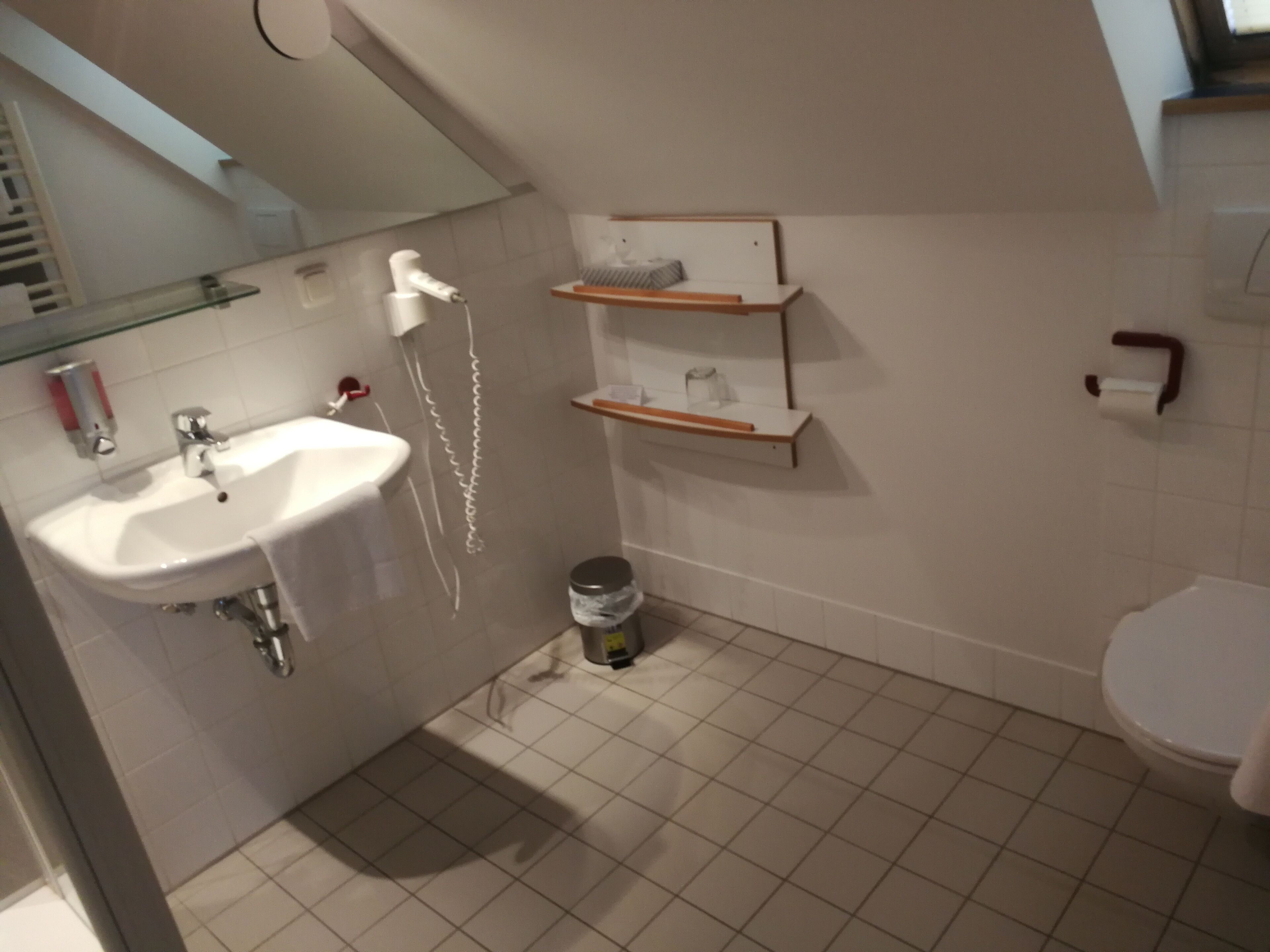 economy single room | bathroom | shower, hair dryer, towels, soap