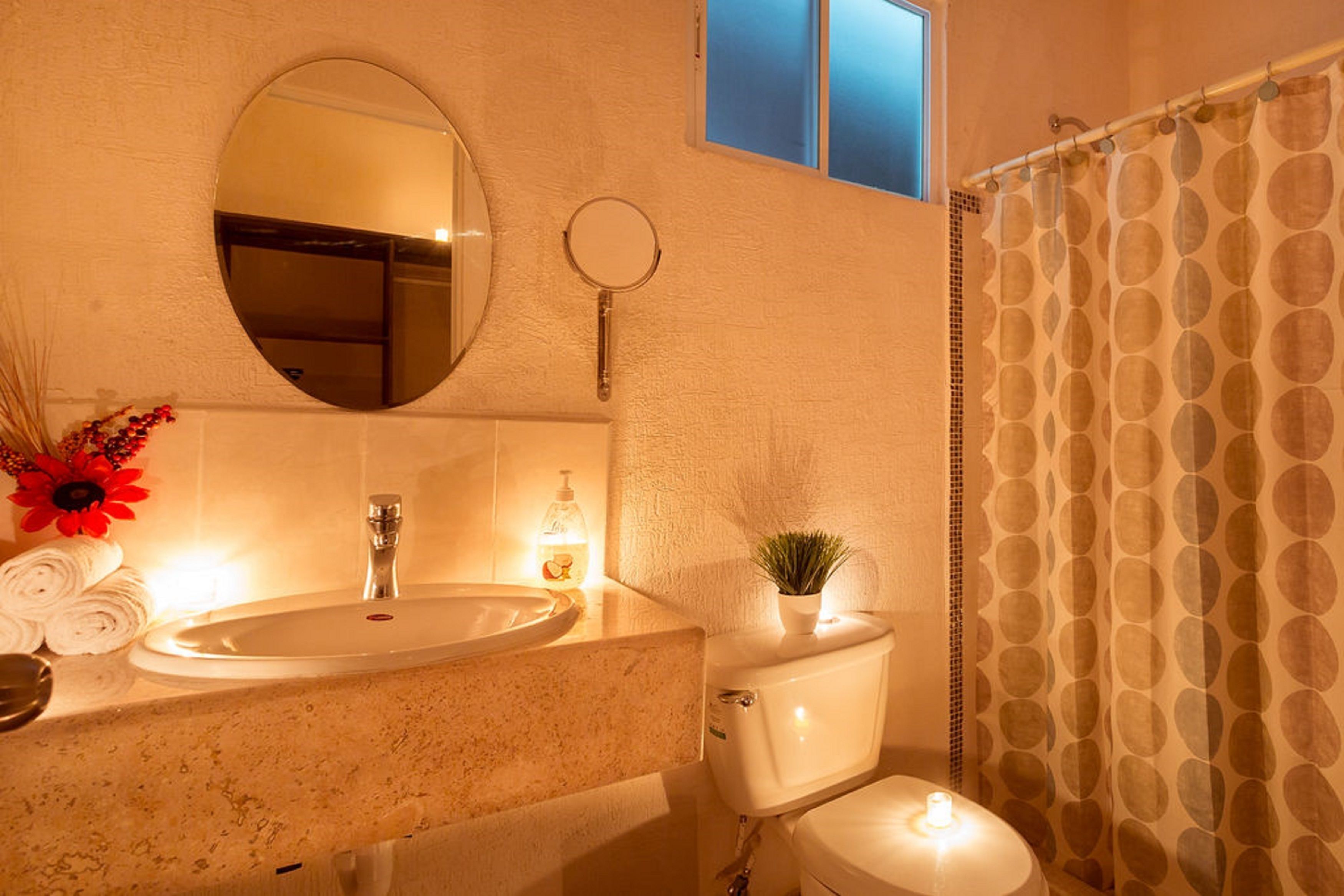 Holiday House, 3 bedrooms, 3 bathrooms, living room, and kitchen | Bathroom | Shower, rainfall showerhead, towels