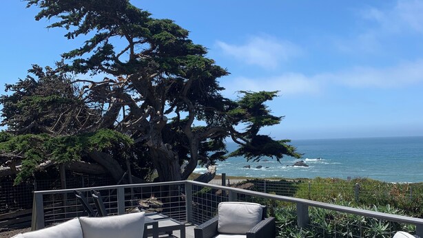 A deck with outdoor furniture, a fire pit, and a view of the ocean. - Bodega Bay - Magical Ocean Front View- Doesn’t get better than this!! (Bodega Bay)