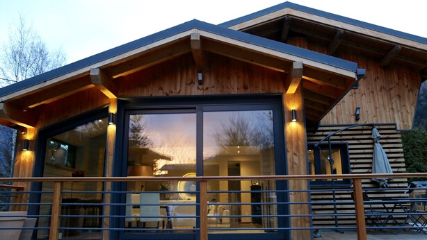 A modern wooden cabin with a large glass door and a deck area. - Contemporary chalet, close to centre of Chamonix (Chamonix)