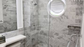 Shower, hair dryer, towels, soap