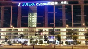 A multi-story building with the sign "SUTERA avenue" prominently displayed. - Comfy Home at Sutera Avenue (Kota Kinabalu)
