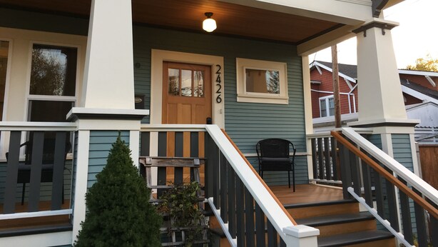 A house with a porch, a staircase, and a mailbox. - The Alberta Petite Hotel (Portland)