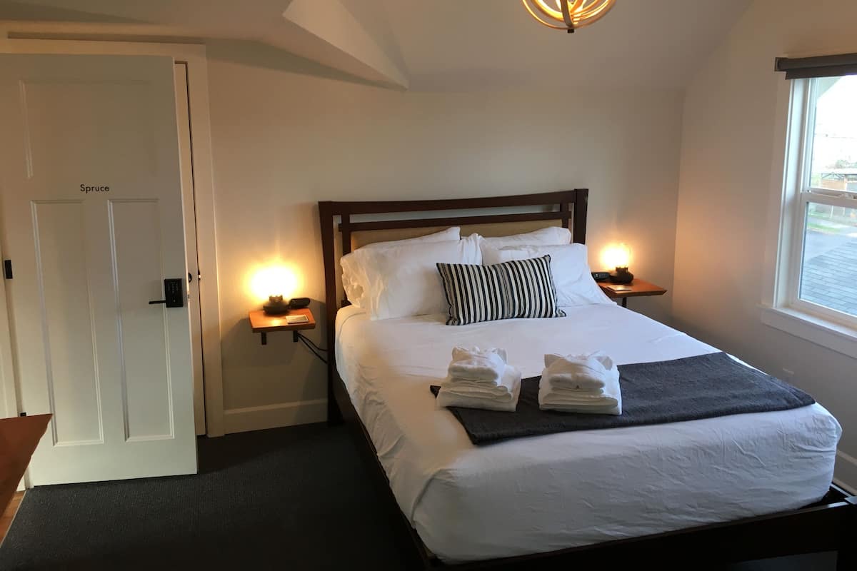 Spruce Room | Premium bedding, down comforters, individually decorated