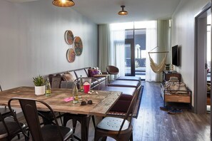 Suite, 1 Bedroom, Hearing Accessible (Roll-in Shower, High Floor) | Living area | 49-inch LCD TV with satellite channels, TV, Netflix