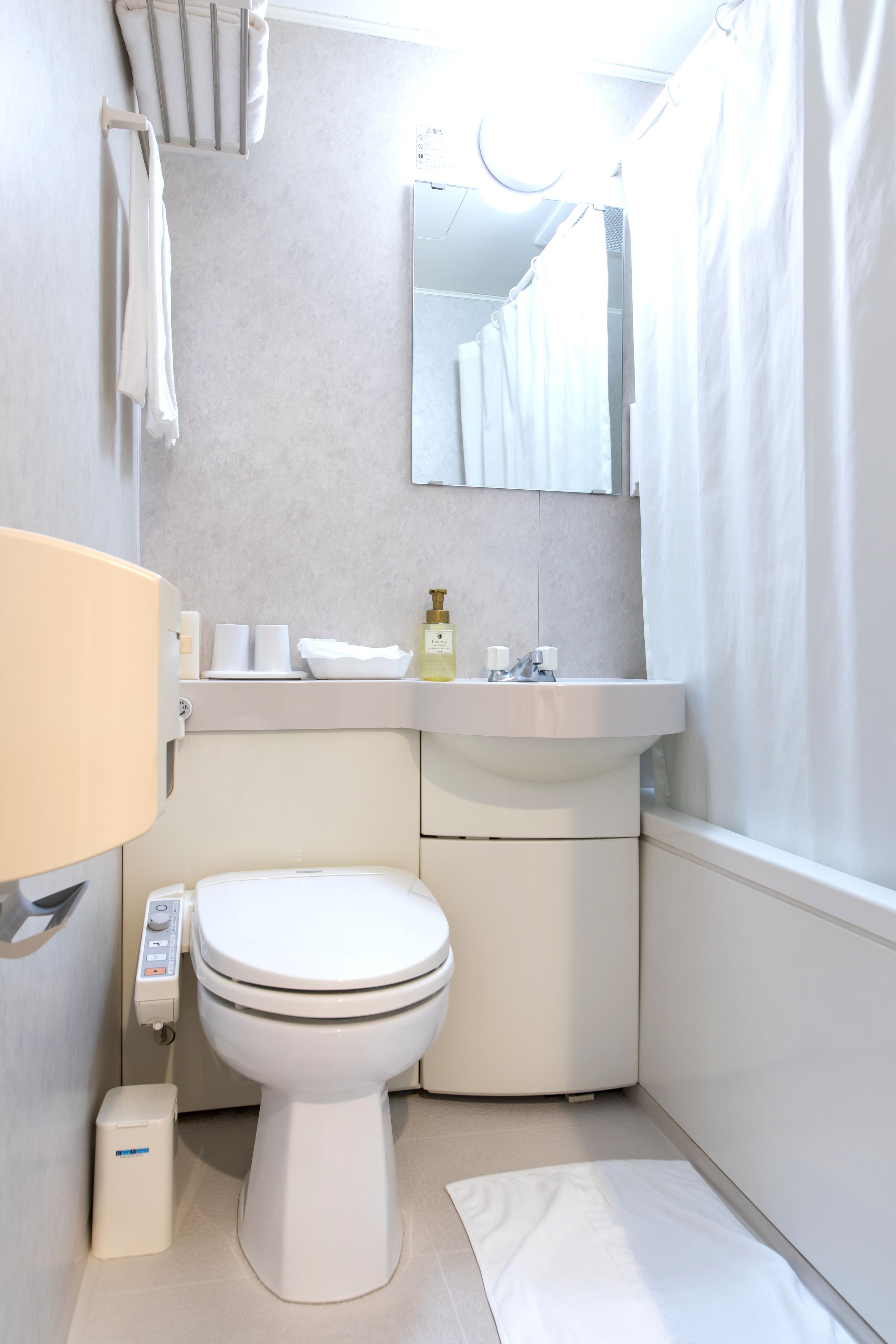 combined shower/bathtub, free toiletries, hair dryer, slippers