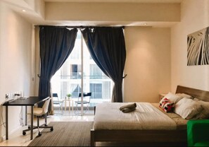 Appartement, 1 chambre, non-fumeurs | 1 chambre, bureau, fer et planche à repasser, draps fournis