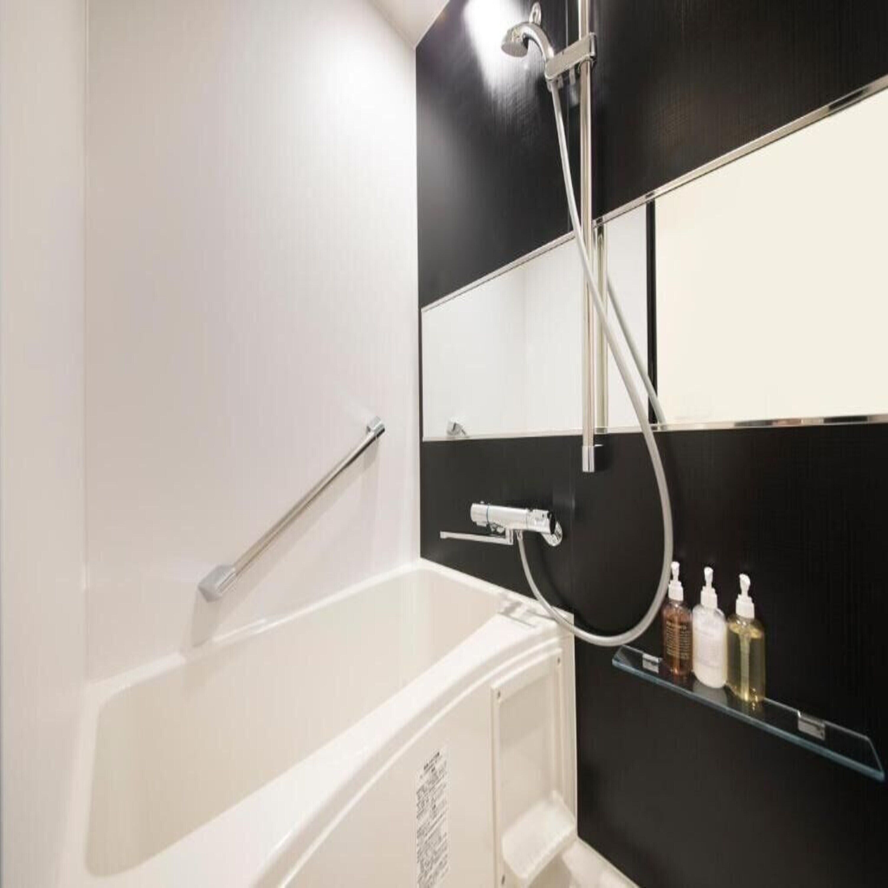 separate bathtub and shower, free toiletries, hair dryer, slippers