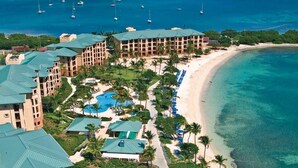 A resort with multiple buildings, a beach, and clear blue waters. - BEACHFRONT LUXURY at the Ritz! NEWLY RENOVATED - MOST DATES Available! (Nazareth)