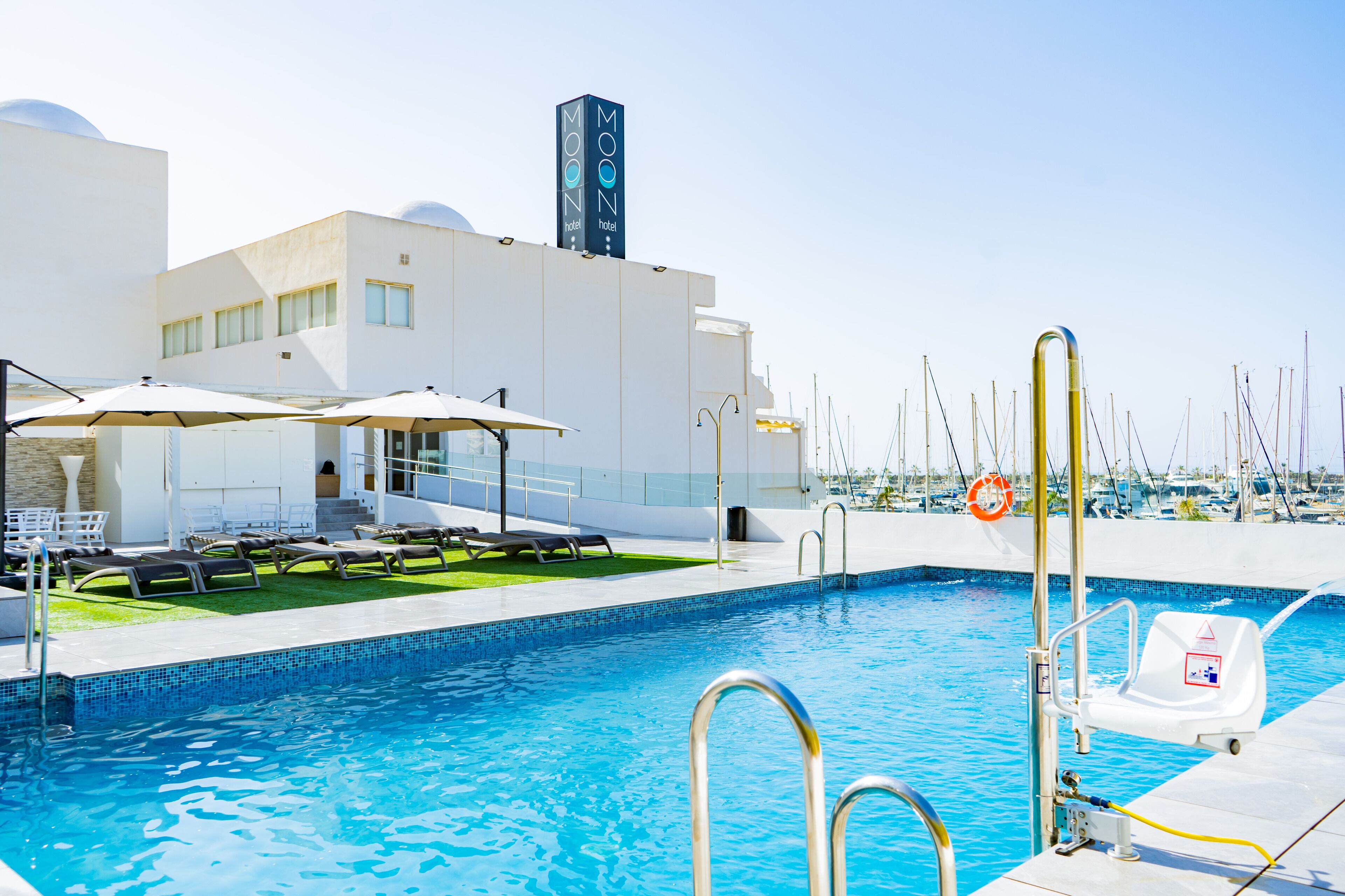 seasonal outdoor pool, pool umbrellas, pool loungers