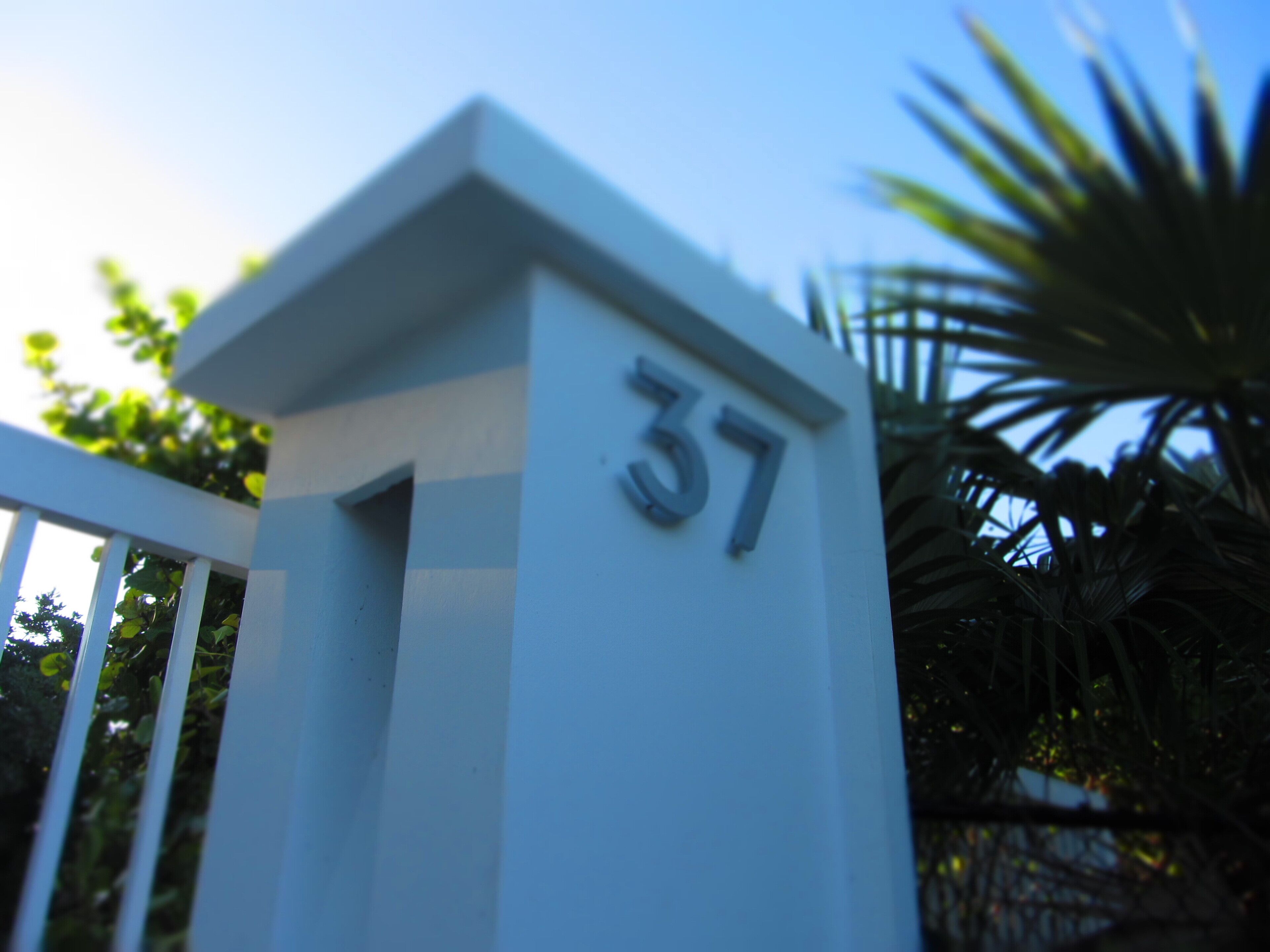 A white building with the number 37 on it.