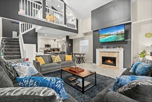 Smart TV, chimenea, reproductor de DVD y futbolito 