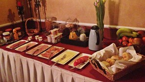 A buffet table with various food items and condiments. - Hotel In den Hoek (Tielt-Winge)