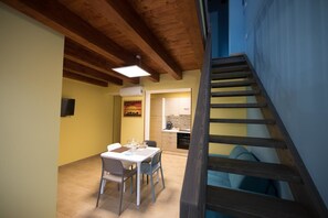 Appartement (Iris) | Repas dans la chambre